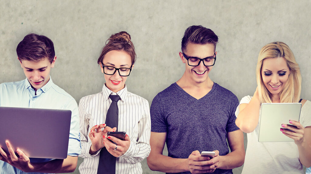 Group of multicultural people connected by using digital devices.