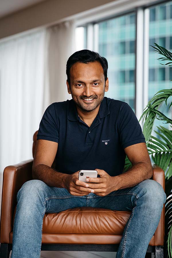 Photo of Gaurav Goel, founder of StayTouch, on a chair