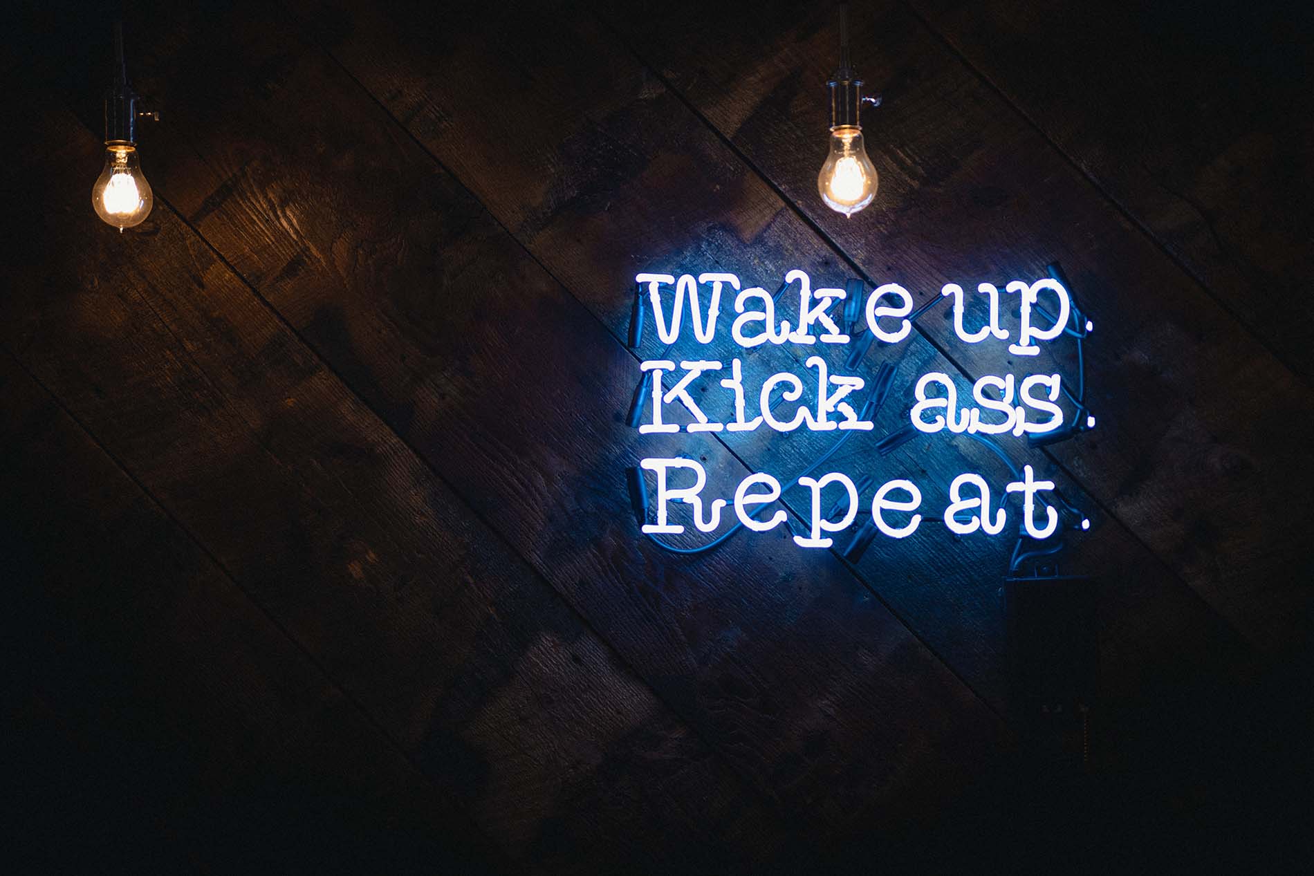 "Wake up, kick ass, repeat." Photo by Justin Veenema/Unsplash.