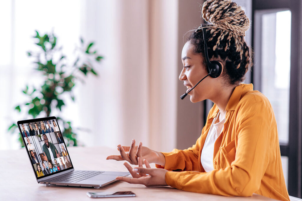 Online business group brainstorm by video conference. Satisfied african american young woman, communicates with business partners by video call uses laptop, multiracial colleagues on a laptop screen. ©Kateryna / AdobeStock