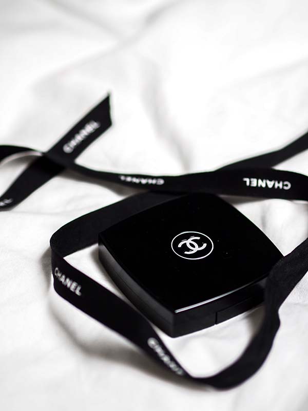 Photo of the Chanel logo on a box. By Laura Chouette/Unsplash.