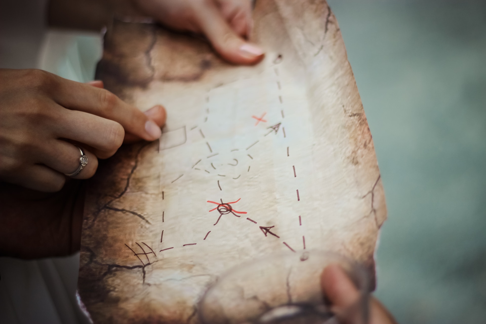 Photo of people looking at a homemade treasure map