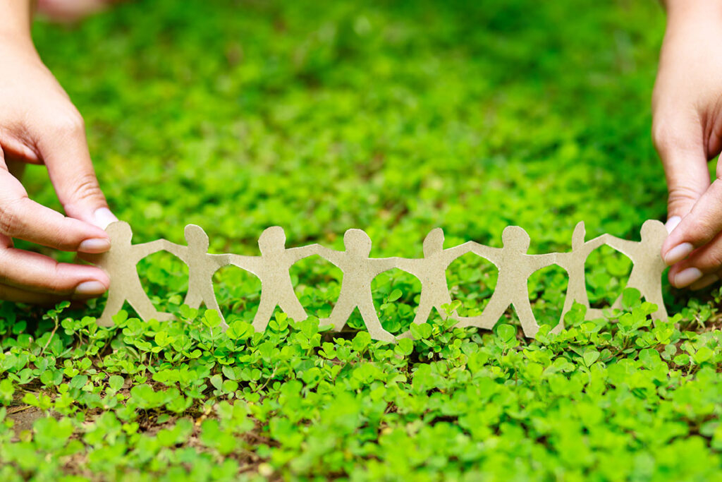 Human Chain on Green Plant, ©patpitchaya / Adobe Stock