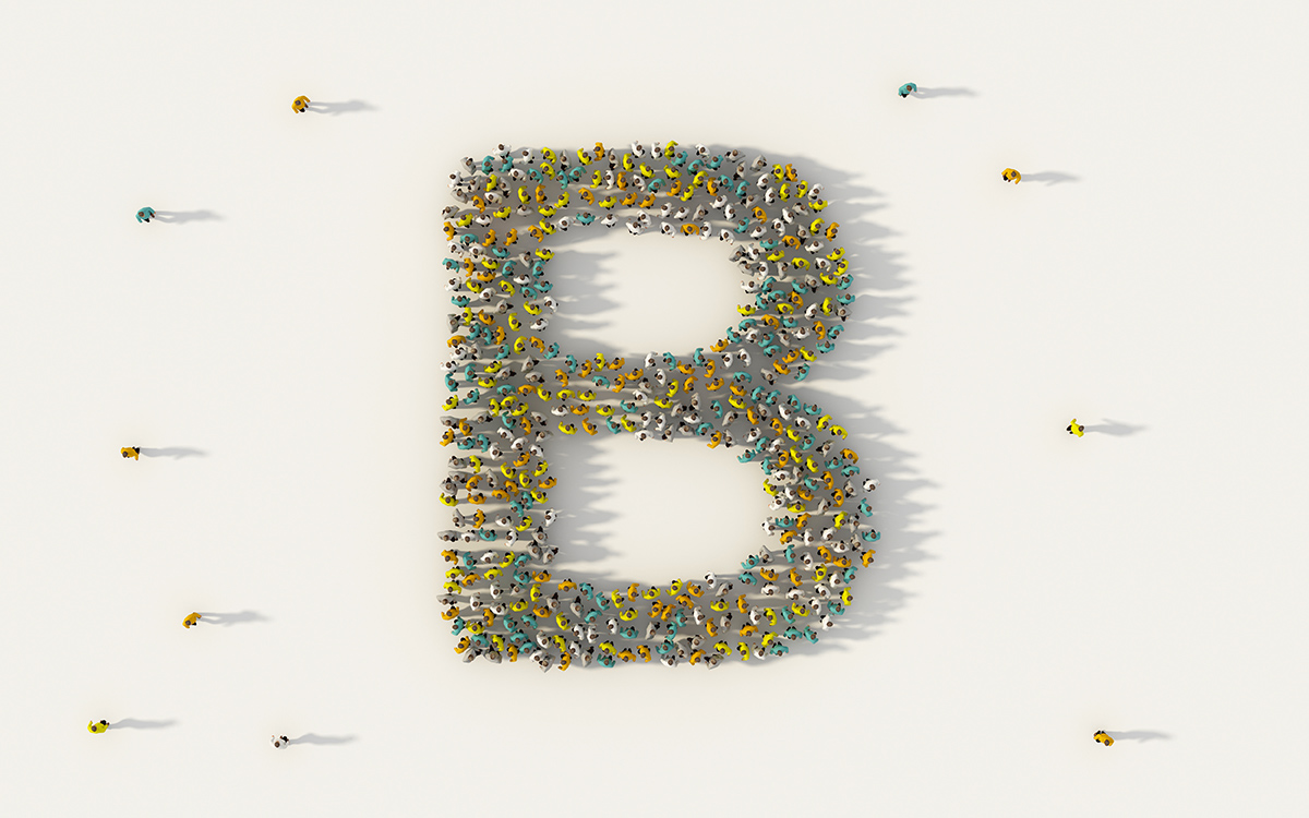 Large group of people forming letter B