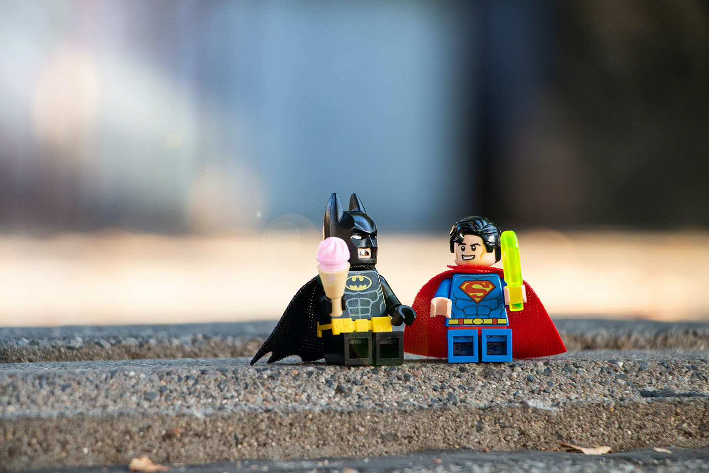 ©Yulia Matvienko/Unsplash, Batman and superman hanging out, illustrating frienship